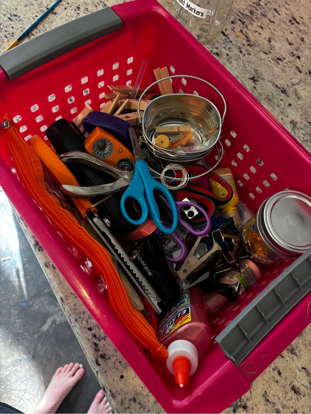 Pink Plastic Storage Bin with a ton of different crafting materials